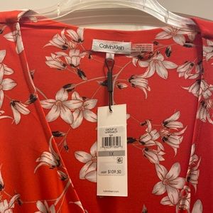 Red with beige accents. Gold waist accent and figure flattering.